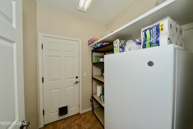 washroom with tile patterned flooring