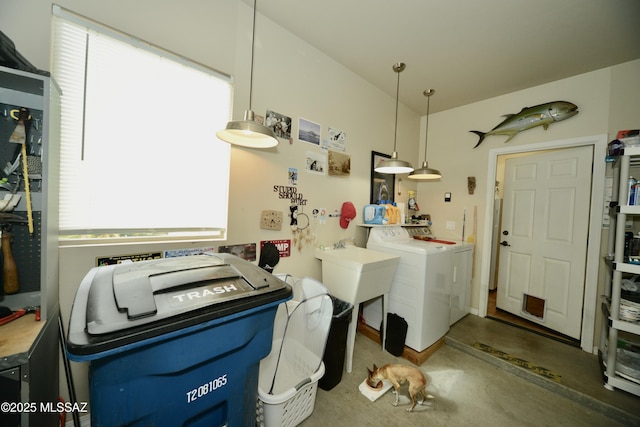 washroom featuring washer and dryer and laundry area
