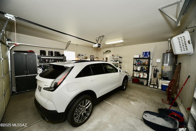 garage with gas water heater and a garage door opener