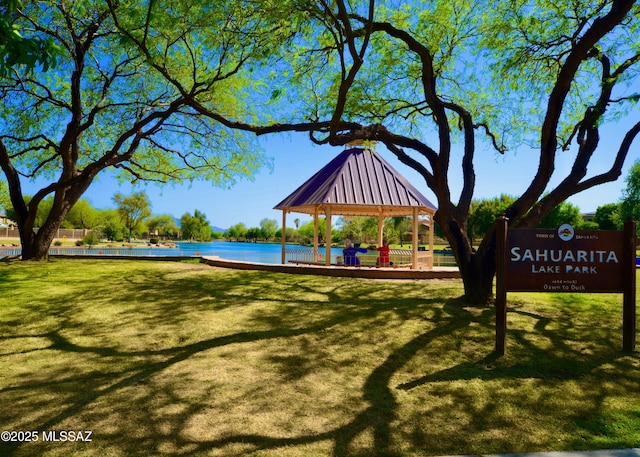 view of property's community with a gazebo and a water view