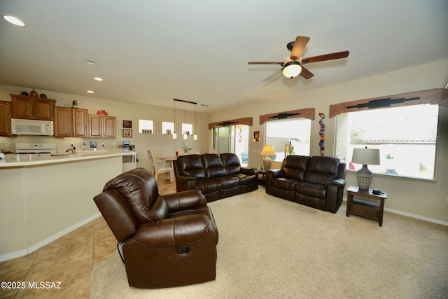 living room with recessed lighting, baseboards, and ceiling fan