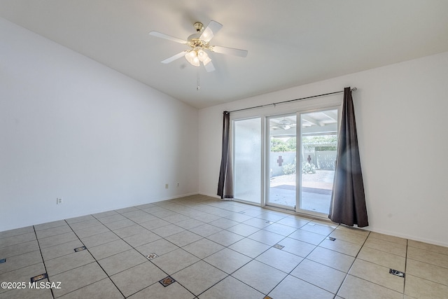 unfurnished room featuring vaulted ceiling, baseboards, a ceiling fan, and light tile patterned flooring
