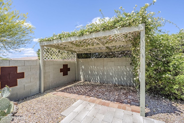 view of patio / terrace with fence and a pergola
