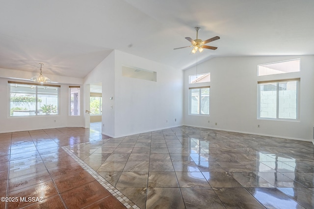 spare room featuring lofted ceiling, baseboards, a ceiling fan, and marble finish floor