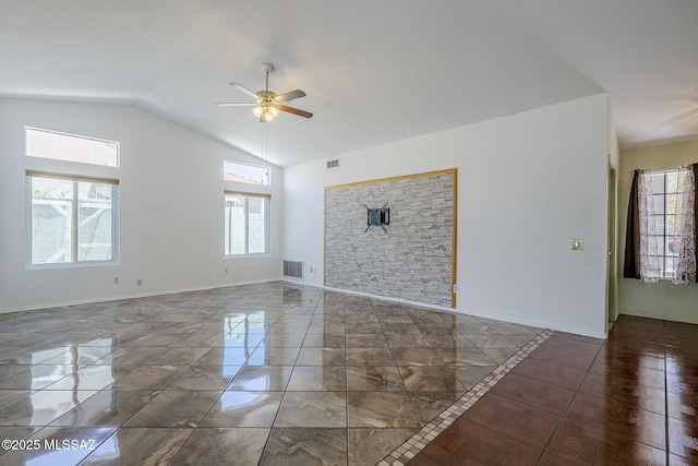 unfurnished living room with vaulted ceiling, visible vents, marble finish floor, and ceiling fan