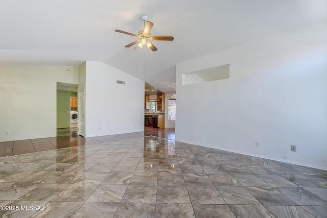 unfurnished living room with vaulted ceiling, visible vents, a ceiling fan, marble finish floor, and washer / dryer