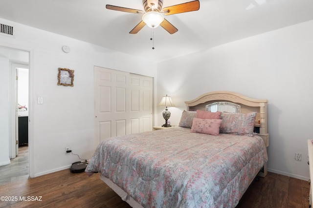 889 Paseo Los Mochis Unit 10, Rio Rico, AZ 85648 - bedroom with baseboards, wood finished floors, a closet, and ceiling fan