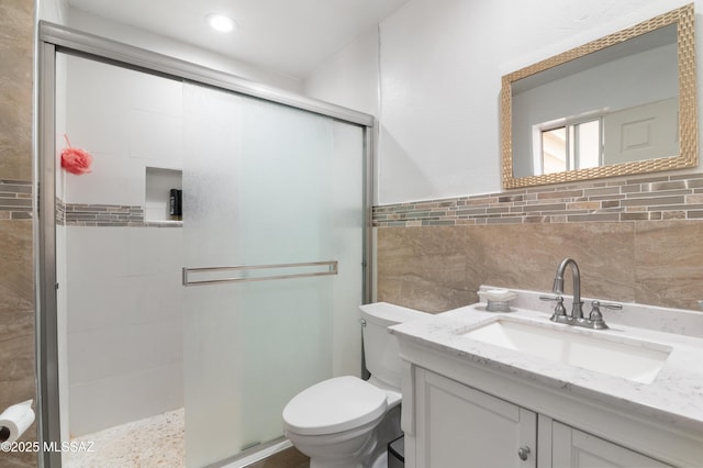 889 Paseo Los Mochis Unit 10, Rio Rico, AZ 85648 - full bath featuring recessed lighting, a shower stall, toilet, vanity, and tile walls