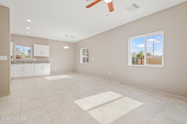 358 W Elvira Rd, Tucson, AZ 85756 - unfurnished living room with visible vents, light tile patterned floors, baseboards, a ceiling fan, and recessed lighting