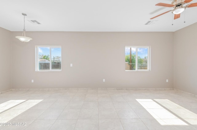 358 W Elvira Rd, Tucson, AZ 85756 - empty room with visible vents, ceiling fan, and a healthy amount of sunlight