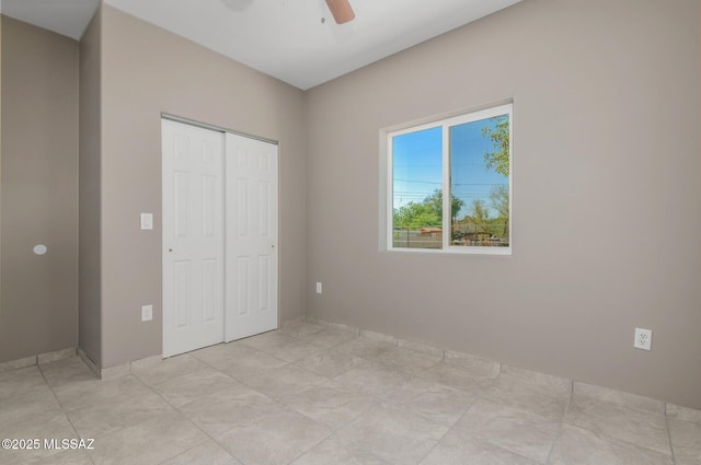358 W Elvira Rd, Tucson, AZ 85756 - unfurnished bedroom featuring a closet and ceiling fan