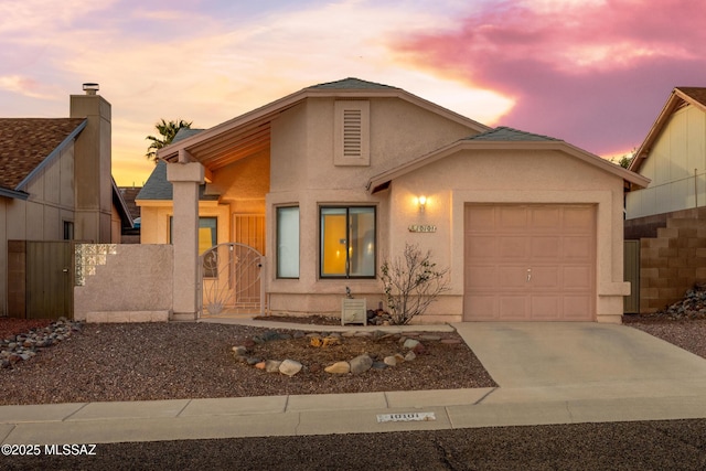 10101 E Bryonwood Ln, Tucson, AZ 85730 - view of front of house with fence, a garage, stucco siding, a gate, and concrete driveway