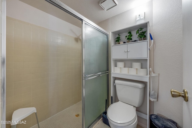 10101 E Bryonwood Ln, Tucson, AZ 85730 - full bath with a textured wall, a stall shower, and toilet