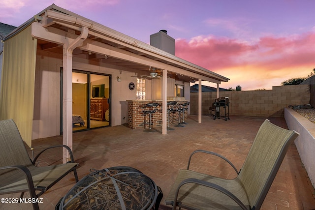 10101 E Bryonwood Ln, Tucson, AZ 85730 - view of patio / terrace with fence private yard, ceiling fan, grilling area, and outdoor dry bar