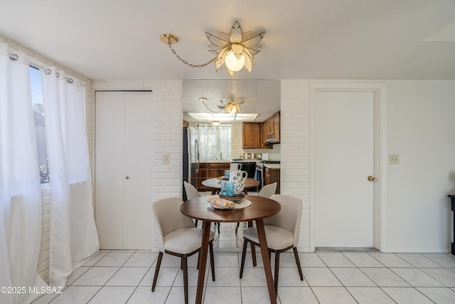 dining area with light tile patterned flooring