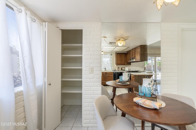 dining space with light tile patterned floors