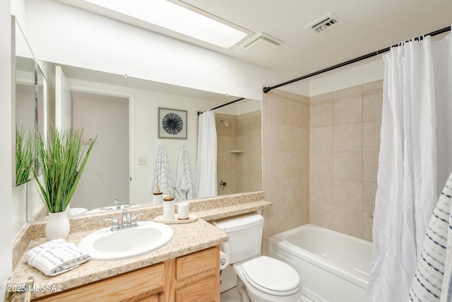 full bath featuring shower / bath combo, visible vents, toilet, and vanity
