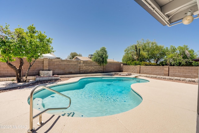 view of pool with a fenced in pool, a patio, and a fenced backyard