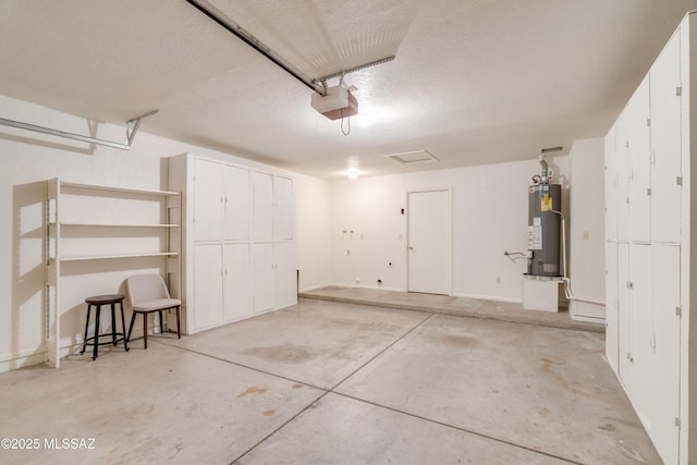 garage featuring a garage door opener and water heater