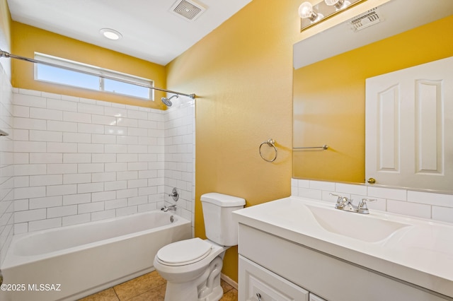 bathroom featuring toilet, vanity, visible vents, and bathing tub / shower combination
