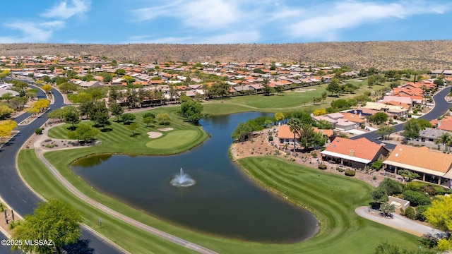 birds eye view of property featuring a water and mountain view, view of golf course, and a residential view
