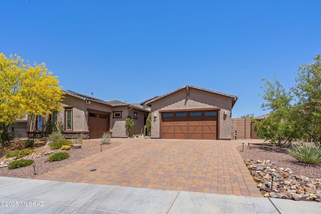 660 W Aviator Crossing Dr, Oro Valley, AZ 85755 - ranch-style house with decorative driveway, an attached garage, and stucco siding