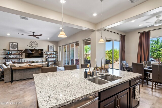 660 W Aviator Crossing Dr, Oro Valley, AZ 85755 - kitchen with ceiling fan, visible vents, hanging light fixtures, dishwasher, and a sink