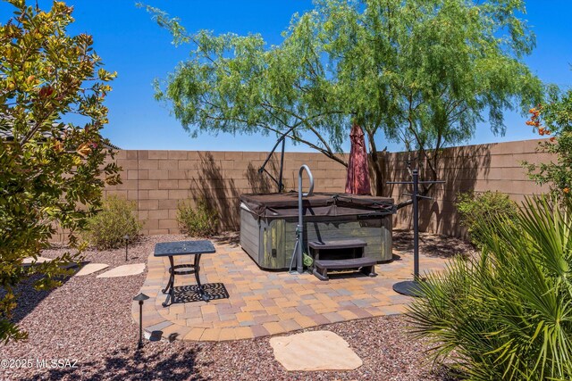 660 W Aviator Crossing Dr, Oro Valley, AZ 85755 - view of patio featuring a fenced backyard and a hot tub