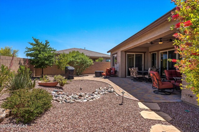 660 W Aviator Crossing Dr, Oro Valley, AZ 85755 - view of yard with a fenced backyard, a ceiling fan, and a patio area
