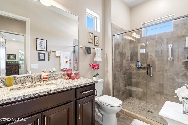660 W Aviator Crossing Dr, Oro Valley, AZ 85755 - full bath featuring vanity, toilet, plenty of natural light, and a stall shower