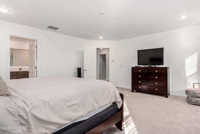 bedroom with recessed lighting, connected bathroom, visible vents, baseboards, and light colored carpet