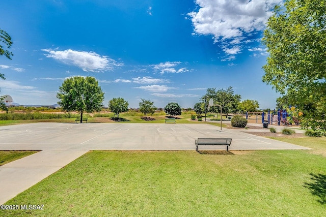 surrounding community with community basketball court, playground community, and a lawn
