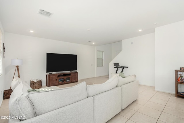 living room with light tile patterned floors, visible vents, and recessed lighting