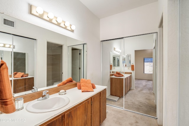 full bathroom with visible vents and vanity