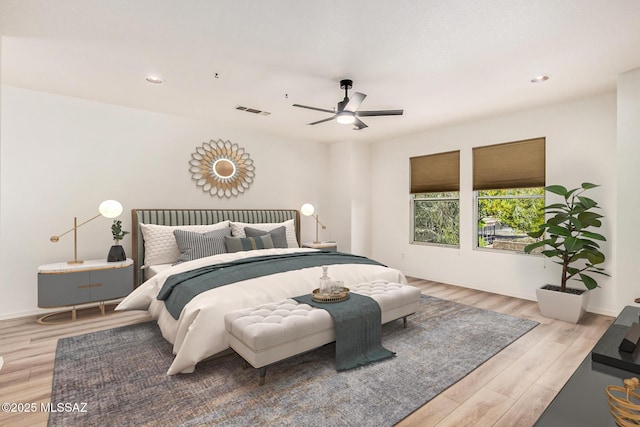 bedroom with recessed lighting, ceiling fan, visible vents, and wood finished floors