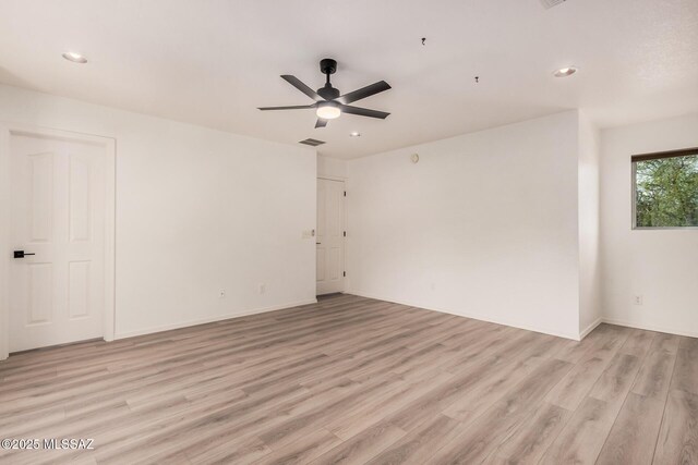 unfurnished room with light wood-type flooring, baseboards, a ceiling fan, and recessed lighting