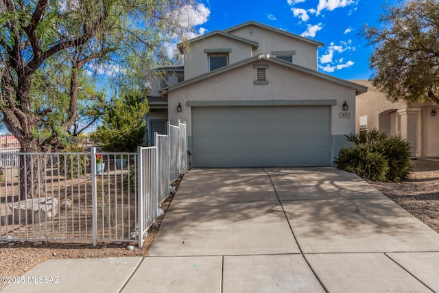 traditional-style home featuring fence, a garage, stucco siding, and driveway