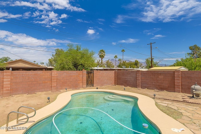view of pool with a fenced in pool and a fenced backyard