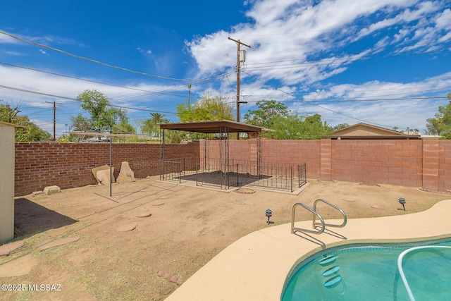 view of swimming pool with a fenced in pool and a fenced backyard