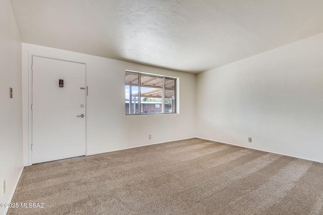 foyer featuring carpet flooring