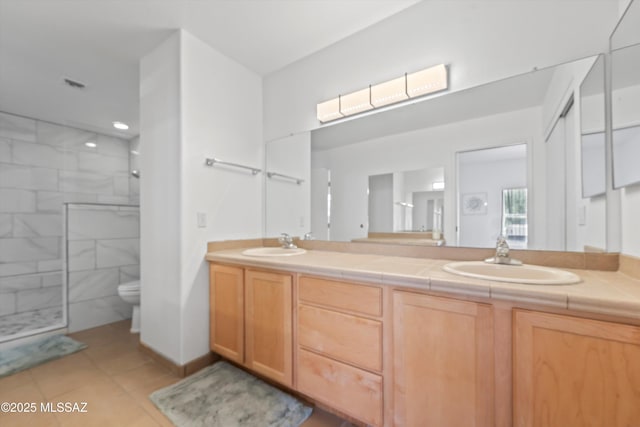 5675 N Camino Esplendora Unit 7-141, Tucson, AZ 85718 - full bath with tiled shower, tile patterned floors, double vanity, and a sink
