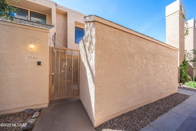 5675 N Camino Esplendora Unit 7-141, Tucson, AZ 85718 - exterior space with stucco siding
