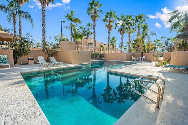 5675 N Camino Esplendora Unit 7-141, Tucson, AZ 85718 - community pool with a patio and fence