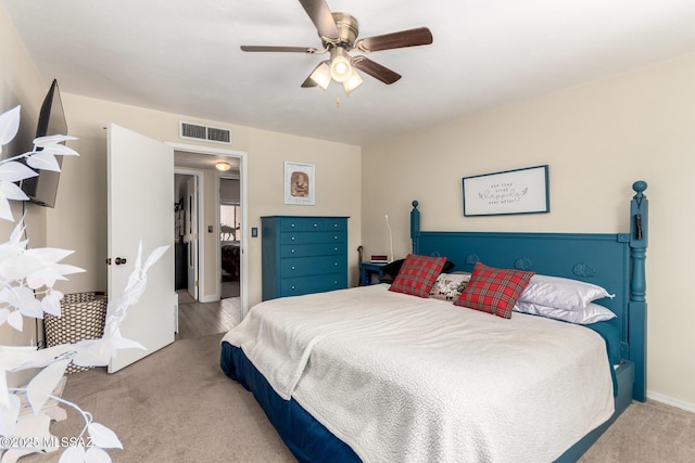 bedroom with carpet flooring, ceiling fan, and visible vents