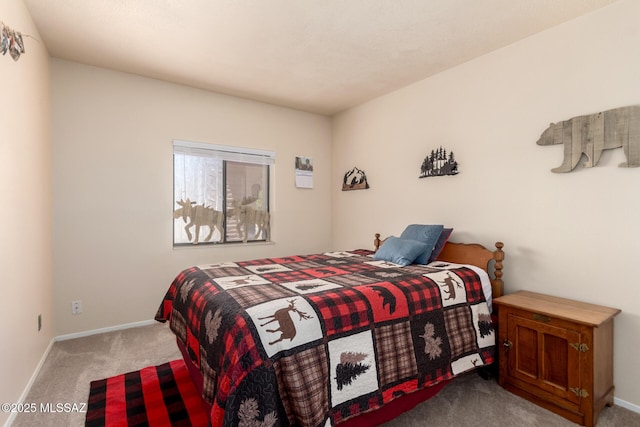 carpeted bedroom featuring baseboards