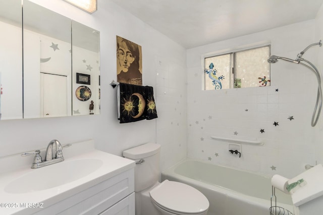 bathroom featuring toilet, bathtub / shower combination, and vanity