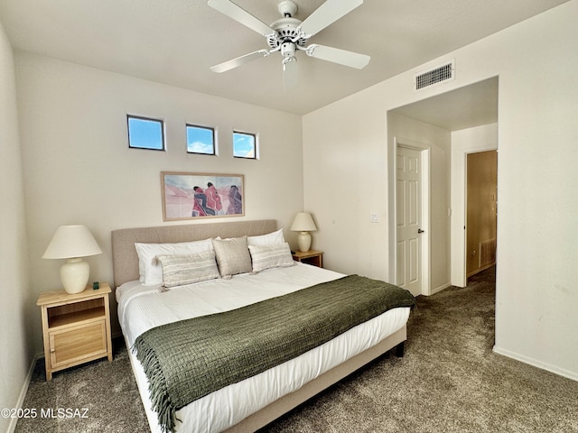 carpeted bedroom with visible vents, baseboards, and ceiling fan