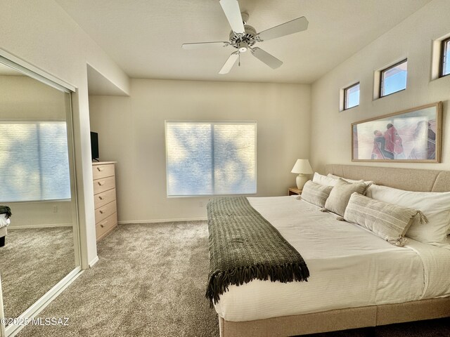 bedroom featuring ceiling fan, baseboards, and carpet