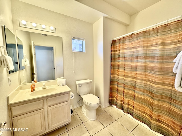 bathroom featuring vanity, toilet, tile patterned flooring, and visible vents