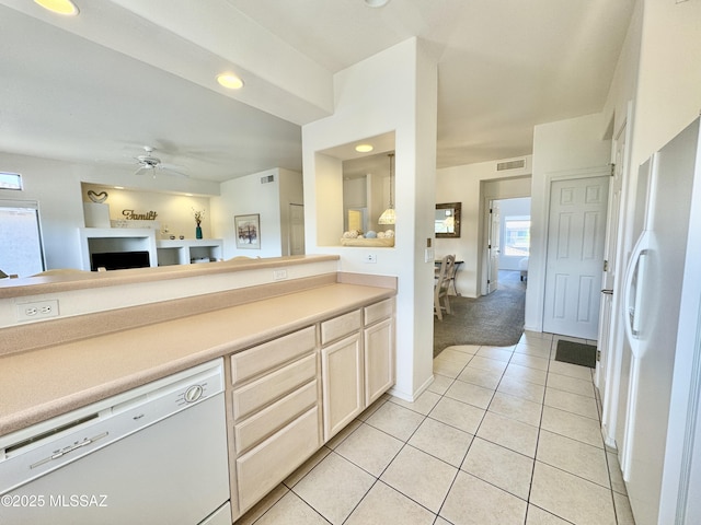 kitchen featuring visible vents, a ceiling fan, white appliances, light countertops, and light tile patterned floors
